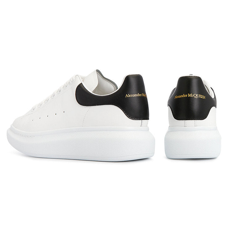 REFERENCE IMAGE ONLY — Alexander McQueen Oversized white/black silhouette; the Ascobar Mirror pair may differ.