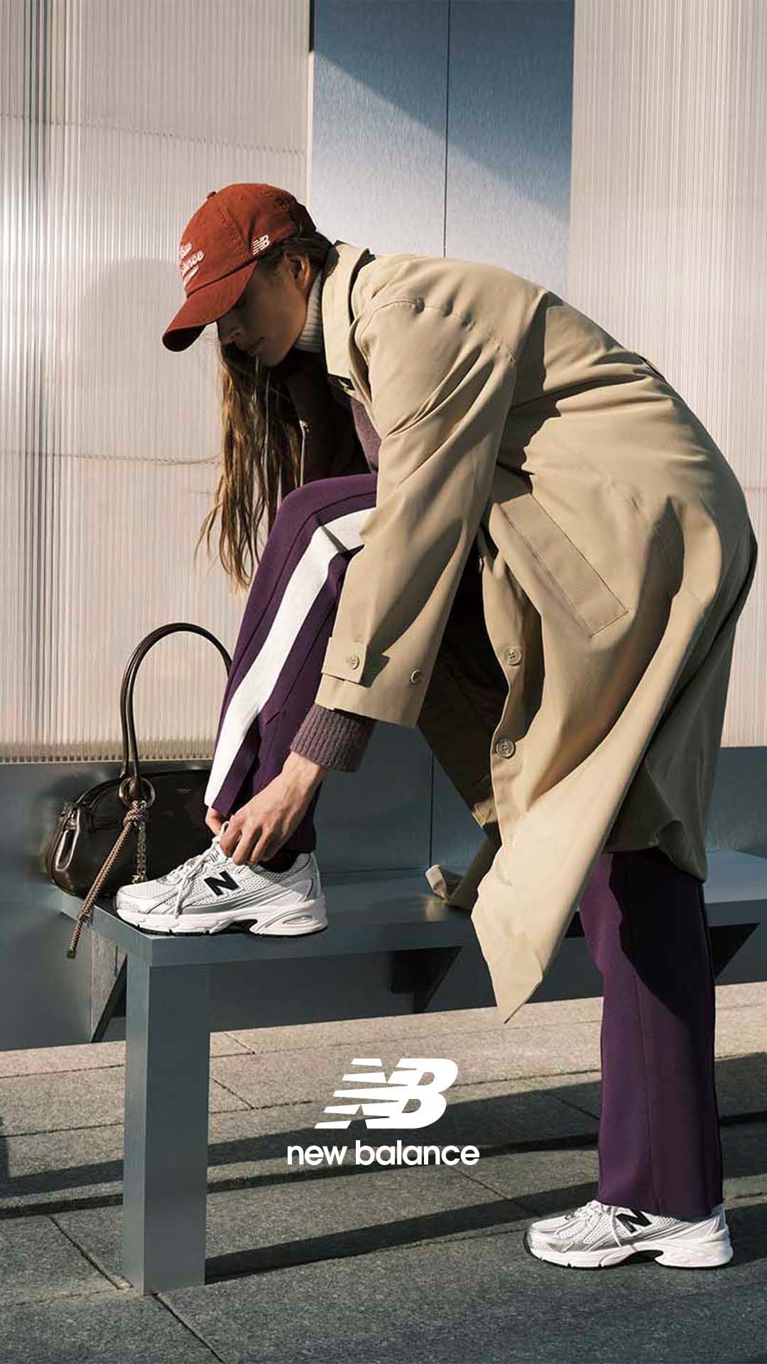 Ascobar sneakers campaign: woman tying gray New Balance sneakers
